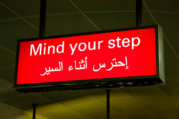 Image showing Arabian mind your step sign