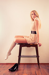 Image showing Beautiful model sitting on table