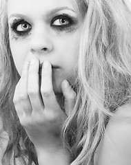 Image showing A sad blond girl with terrified expression