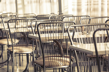 Image showing Photo of a canteen with metal chairs and tables