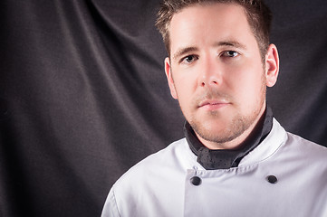 Image showing A confident cook against dark background