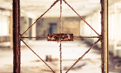 Image showing Vintage broken window with blurry corridor