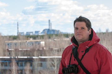 Image showing Handsome young explorer and the power plant