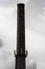 Image showing Big industrial chimney against sky