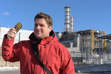 Image showing Handsome young explorer and the power plant