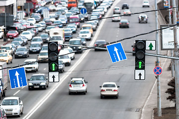 Image showing Green traffic lamps and blue sign
