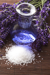 Image showing Lavender flowers with the bath salt and essential oil