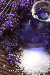 Image showing Lavender flowers with the bath salt and essential oil