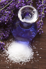 Image showing Lavender flowers with the bath salt and essential oil