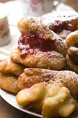 Image showing Sweet doughnuts with rose marmelade