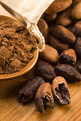 Image showing Cocoa (cacao) beans on natural wooden table