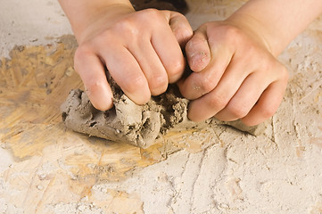 Image showing Child hands of a potter