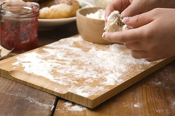 Image showing Detail of hands kneading dough