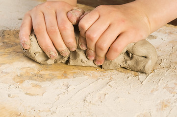 Image showing Child hands of a potter