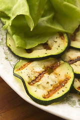 Image showing Grilled organic zucchini slices with herbs and spices