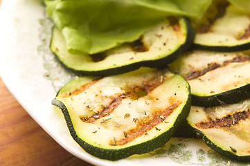 Image showing Grilled organic zucchini slices with herbs and spices