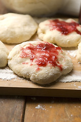 Image showing Sweet doughnuts with rose marmelade