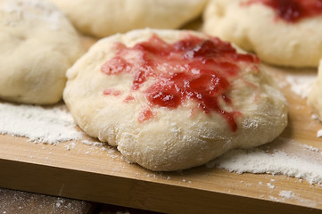 Image showing Sweet doughnuts with rose marmelade