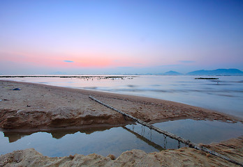 Image showing Tropical sunset on the beach.