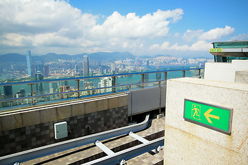 Image showing rooftop of a skyscraper over a big city 