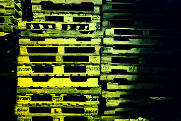 Image showing pile of pallets at night