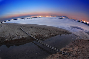 Image showing Tropical sunset on the beach.