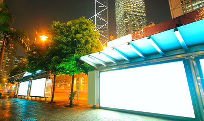 Image showing Blank billboard on bus stop at night 