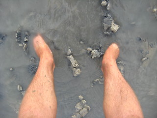 Image showing Legs of the person standing in a dirt