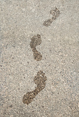 Image showing Wet footprints on granite