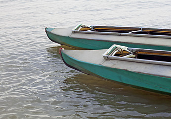 Image showing Canoes on still water