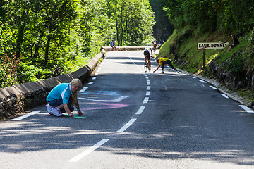 Image showing Woman Painting the Road to Col d'Aubisque