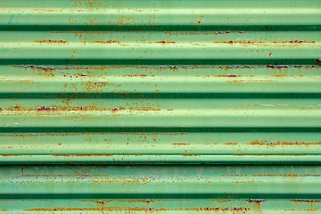 Image showing Rusty metal surface painted in green