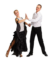 Image showing Young couple performs ballroom dance