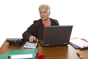 Image showing Calculating female senior with laptop