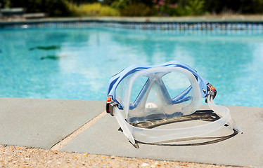 Image showing Swimming mask by side of blue pool