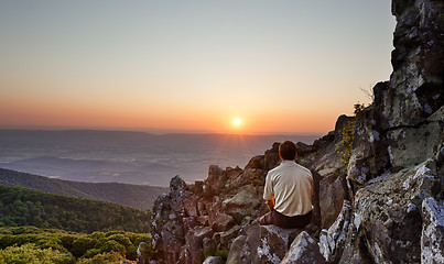 Image showing Senior man watches sunrise over blue ridge