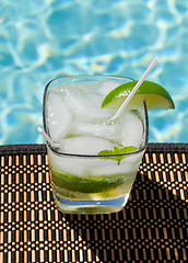 Image showing Cocktail Majito on edge by poolside