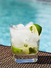 Image showing Cocktail Majito on edge by poolside