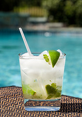 Image showing Cocktail Majito on edge by poolside