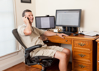 Image showing Senior male working in home office