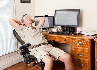 Image showing Senior male working in home office