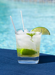 Image showing Cocktail Majito on edge by poolside