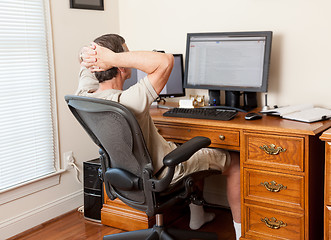 Image showing Senior male working in home office