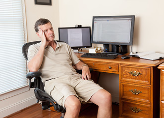 Image showing Senior male working in home office