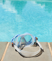 Image showing Swimming mask by side of blue pool