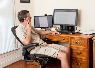 Image showing Senior male working in home office