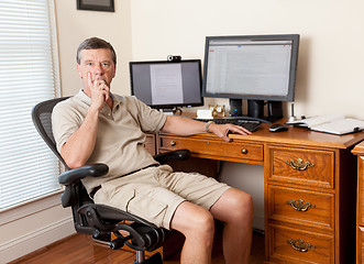 Image showing Senior male working in home office