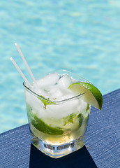 Image showing Cocktail Majito on edge by poolside