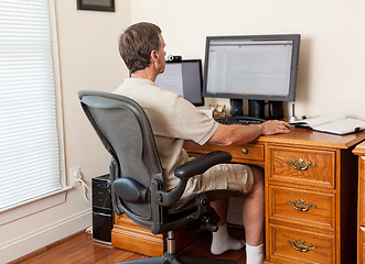 Image showing Senior male working in home office