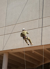 Image showing abseiling down the wall